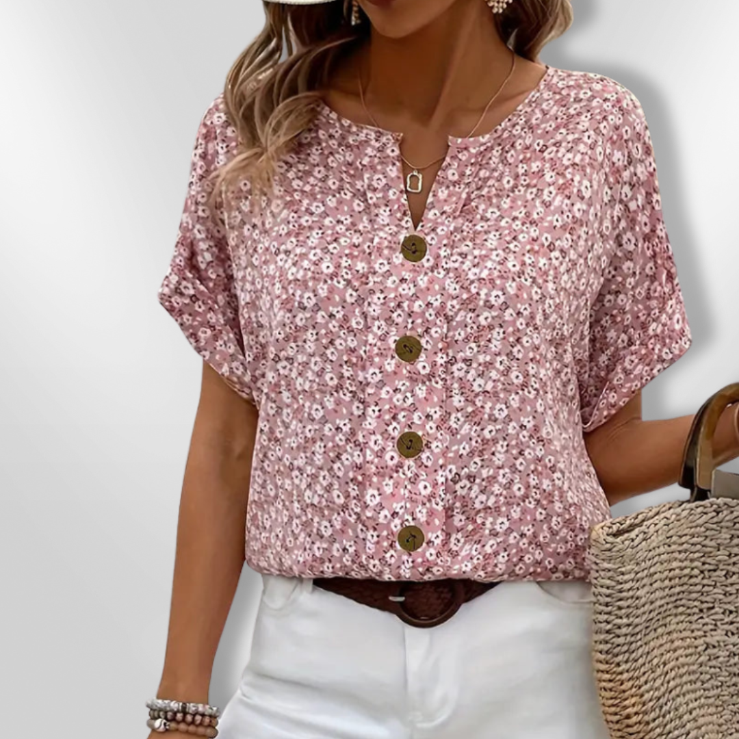 Blomstret sommerbluse for kvinner med lett stoff og avslappet passform. Elegant for hverdag og fest.