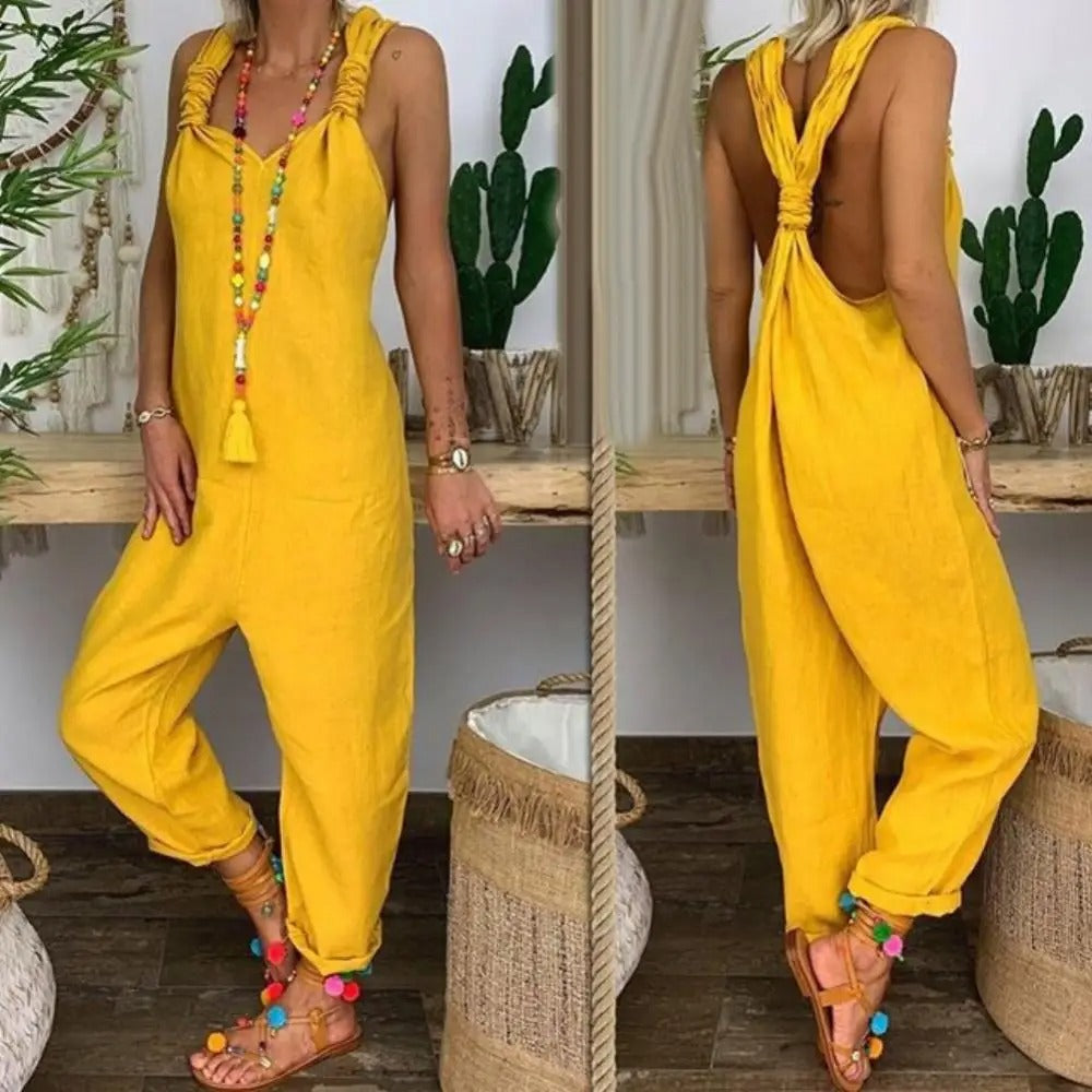 Luftig og lett jumpsuit for dame, med stilige knytestropper og ryggløs design for varme dager.