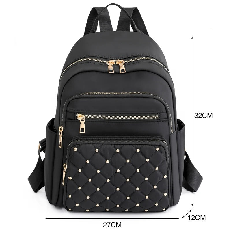 Allsidig lett nylonsekk for kvinner. Bruk den som vanntett skolesekk, reisesekk eller hverdagsbag.