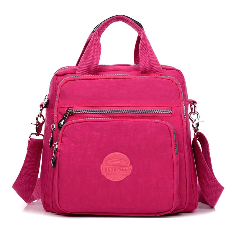 Lettvekts dame crossbody-veske i slitesterk nylon, ideell for reise og hverdag.