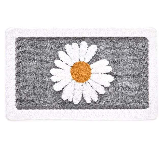 Grønn baderomsmatte med søte tusenfryd. Blomstermønster for et levende og dekorativt bad.