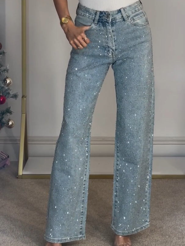 Trendy damejeans med høy midje og glitter, flatterende passform for både hverdag og fest.
