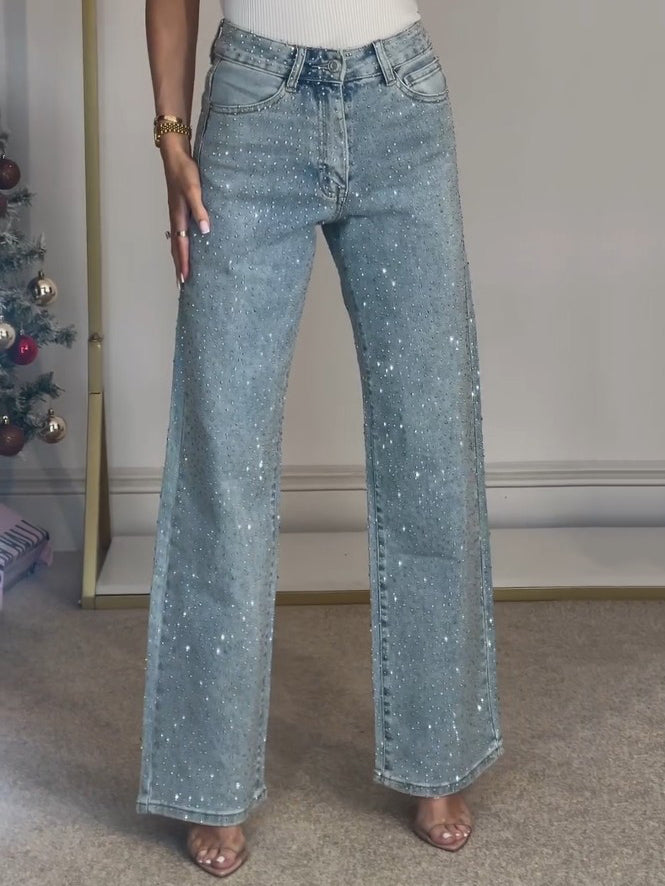 Komfortable mørkeblå damejeans med elegant høy midje og subtile glitterdetaljer.