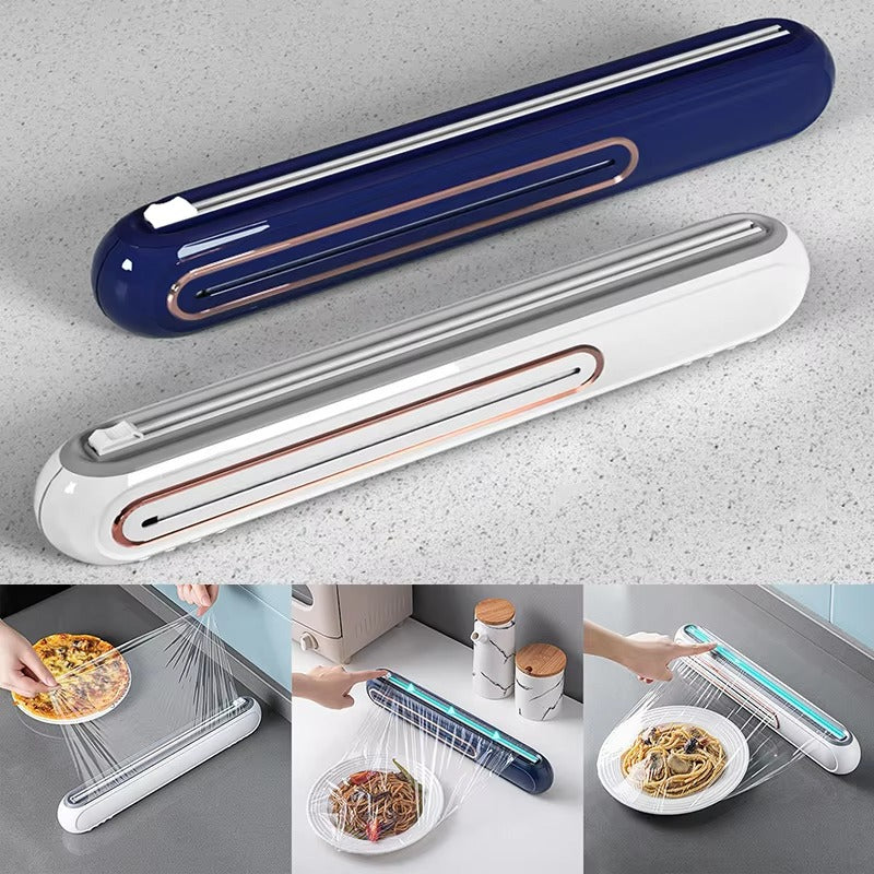 Nærbilde av hvit magnetisk plastfoliedispenser med presisjonskutter, plassert på et moderne kjøkken.