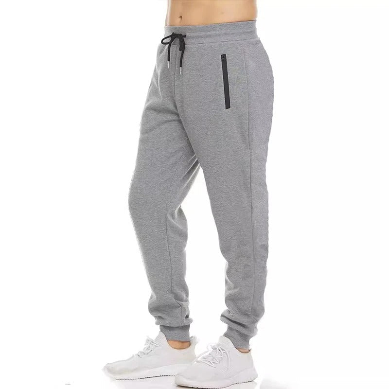 Svarte menns joggebukser med glidelåslommer, ideelle for trening og fritid.