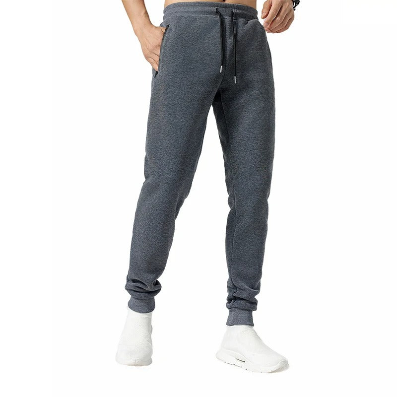 Allsidige grå joggebukser for menn, til trening, aktivitet og avslappet fritidsbruk.
