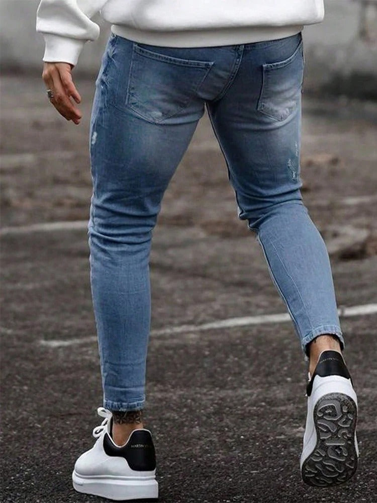 Denim menns rippede skinny jeans, komfortable og stilige for urbane og motebevisste menn.