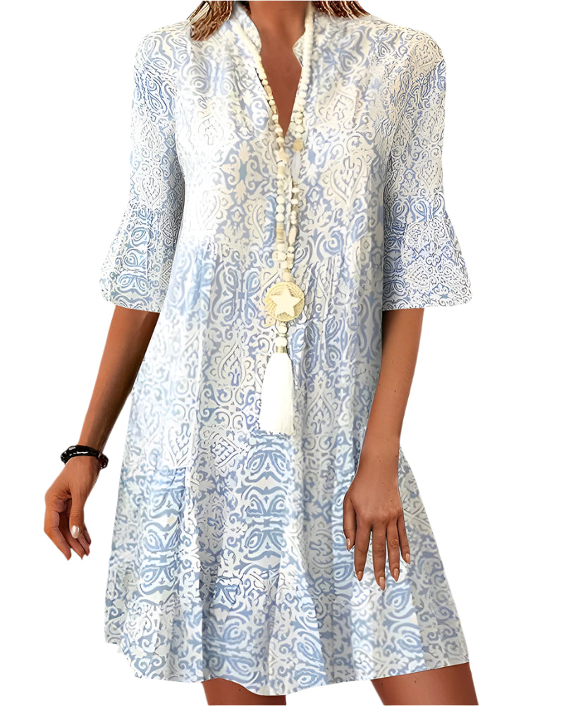 Moderne damekjole med unikt, fargerikt print. Elegant og allsidig sommerkjole for kvinner, perfekt til fest og hverdag.