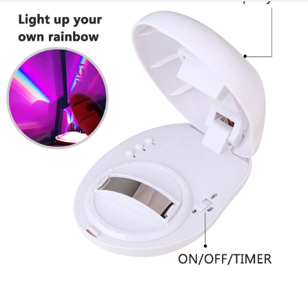 Stilren eggformet regnbueprojektor lampe i moderne design, ideell for interiør og festbelysning.
