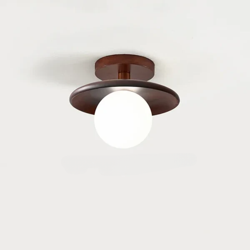 Kuleformet taklampe i tre sett nedenfra. Viser moderne, minimalistisk design og LED-kompatibilitet for innendørs lys.