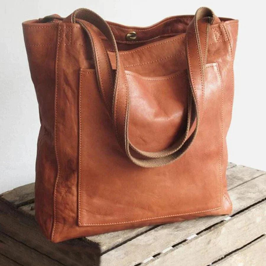 Svart elegant skulderveske for kvinner. Allsidig dameveske med justerbar rem. Perfekt for stilbevisste.