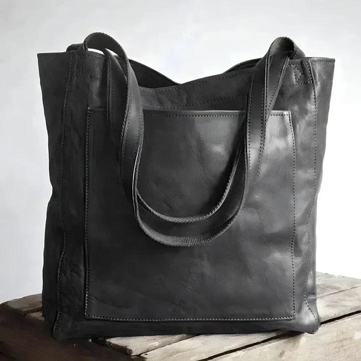Organiserende skulderveske for kvinner i moderne design. Elegant håndveske med praktiske rom for hverdagen.