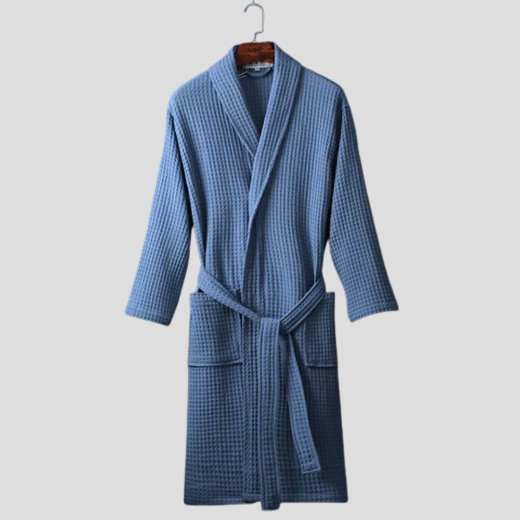 Elegant unisex bomullsbadekåpe med lang passform og praktisk knytebelte. Perfekt for alle kroppstyper.