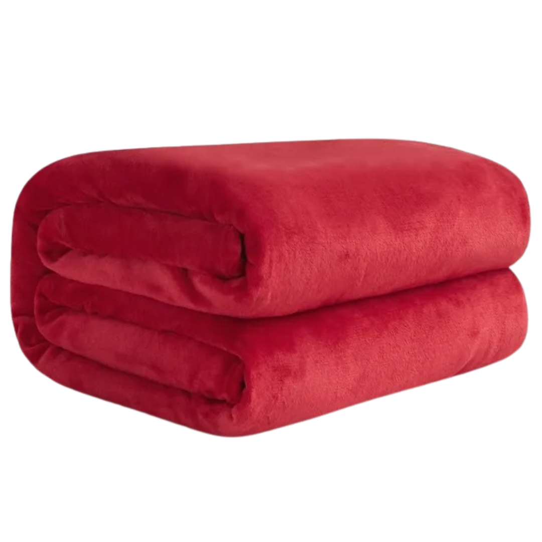 Koselig ensfarget korallfleece pledd, ideelt som sofadekke eller et lett sengeteppe.