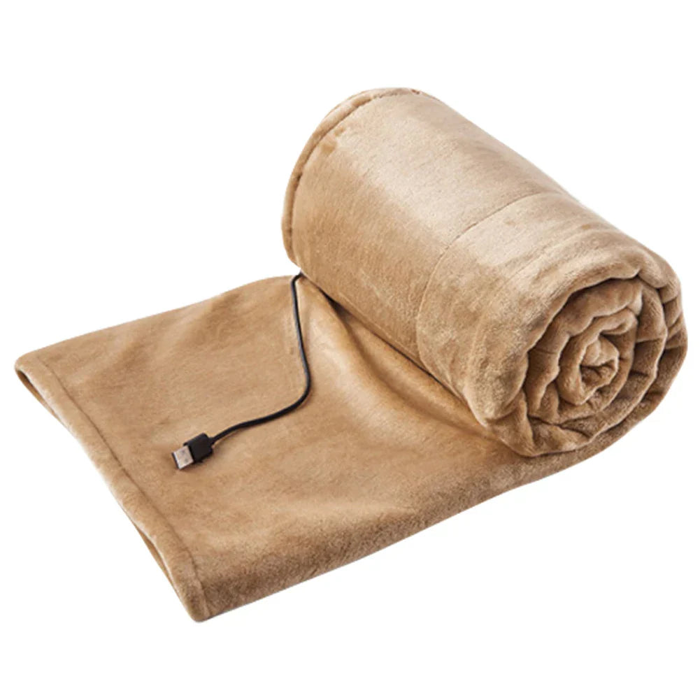 Nærbilde av det luksuriøse, myke fleecestoffet på et USB oppvarmet teppe, gir varm og koselig følelse.