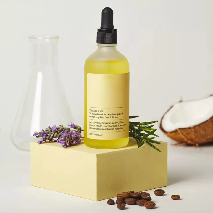 Kvinners naturlige hårvekst serum med castorolje, arganolje og kokosolje for sunn hodebunn.