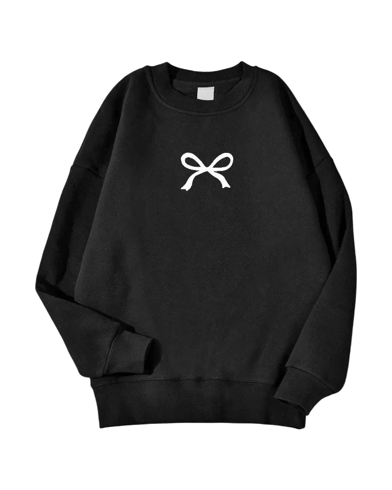 Oversized damegenser i varm bomullsblanding med feminin sløyfe. Komfortabel og koselig for hverdag.