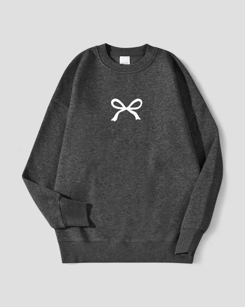 Myk oversized fleecegenser for dame, med elegant sløyfedesign. Perfekt for varme og stil.