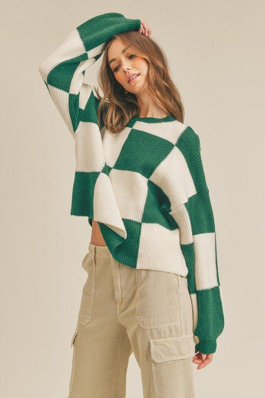 Komfortabel og varm rutete oversized genser for damer. En trendy og avslappet stil for kalde dager.