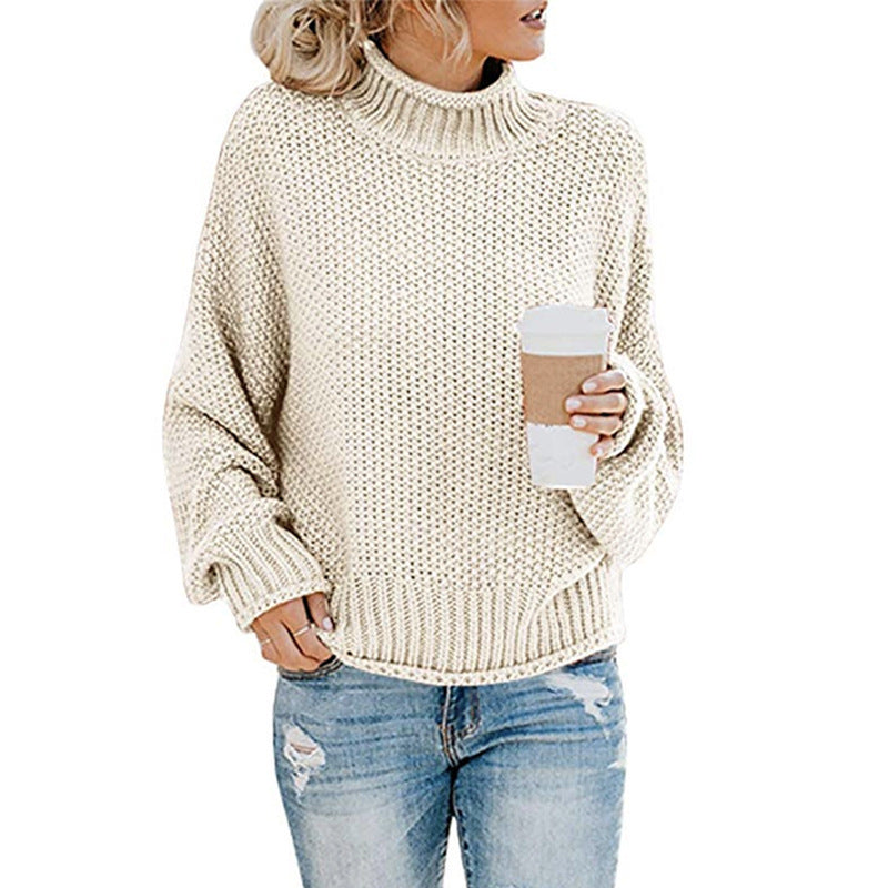Trendy oversized dame strikkegenser med høy hals og batwing-ermer. Komfortabel vintermote.