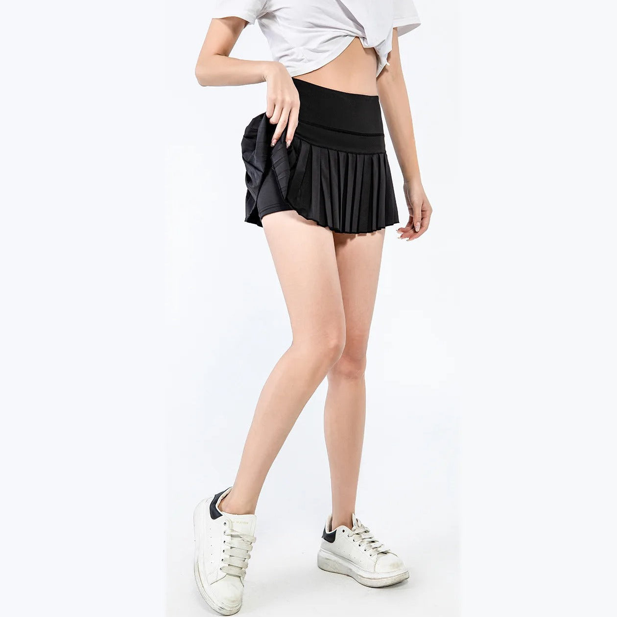 Trendy plissert sportsskjørtshorts for kvinner, designet for optimal ytelse og bevegelsesfrihet.