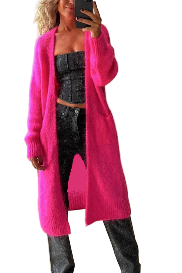 Rosa oversized damecardigan, langline og behagelig med åpen front og lommer. Perfekt for høststil og vintermote.
