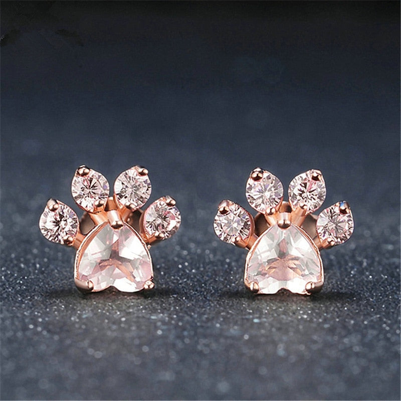 Søte kattepote stud øredobber i rosegull med detaljert design. Trendy ørepynt for kvinner.