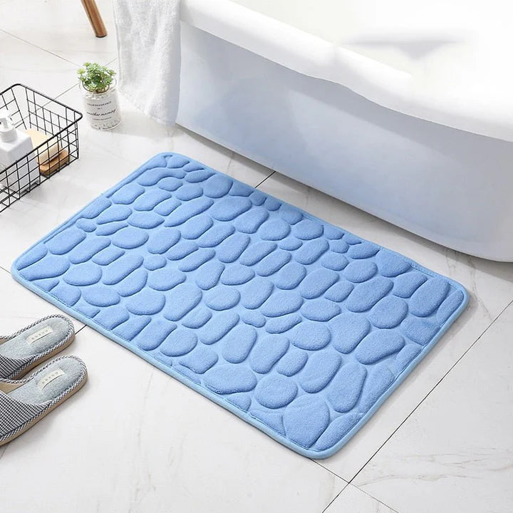 Elegant brosteinsdesign badematte som løfter baderomsinnredningen. Sklisikker og komfortabel for hjemmet.