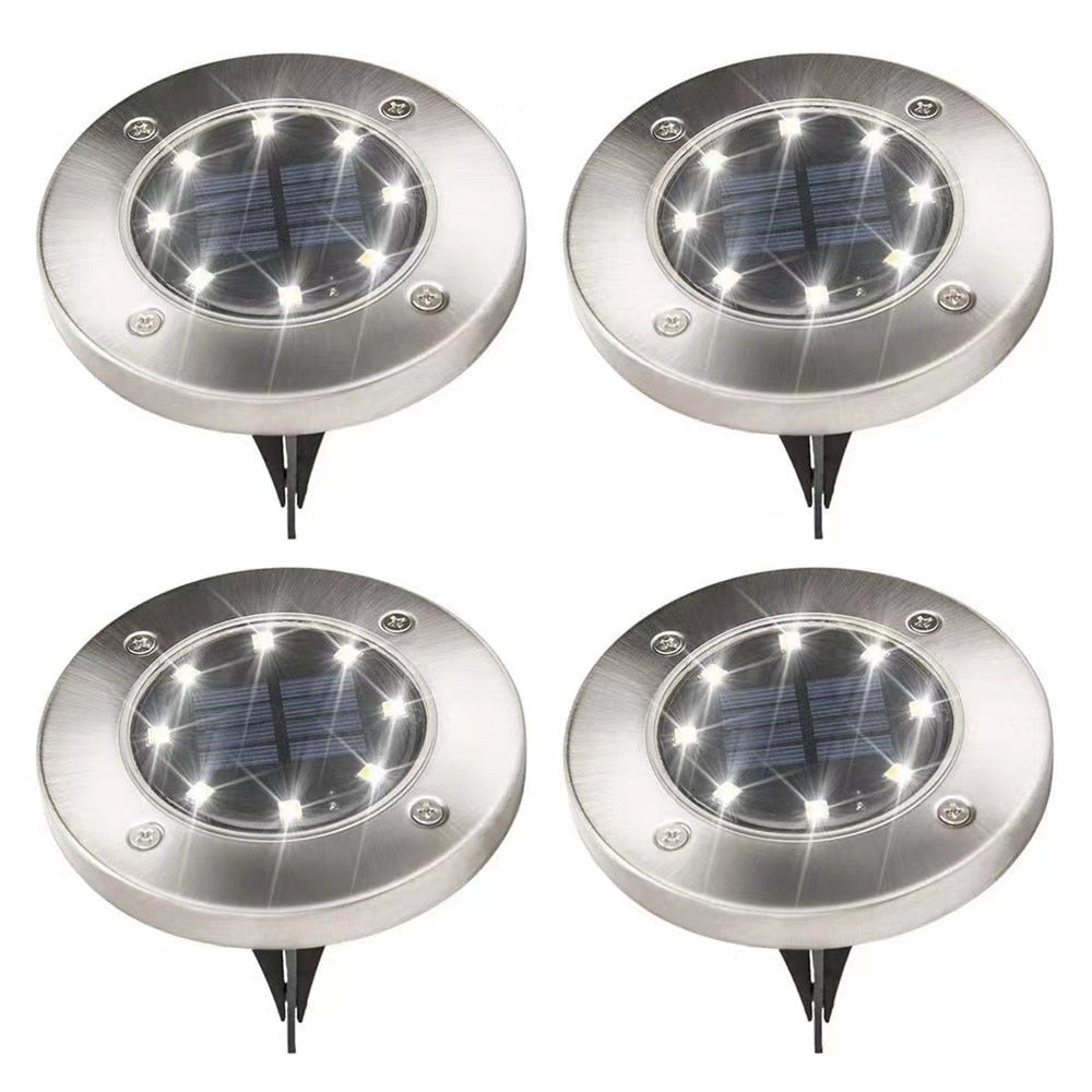 Solcelle disklys med 8 LED for utendørs hage- og plenbelysning. Energibesparende og vanntett.