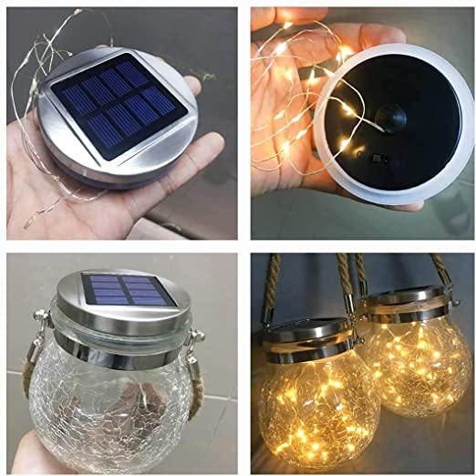 Lysende solcellelampe i sprukket glass med hampsnor, gir varmt og dekorativt stemningslys i mørket.