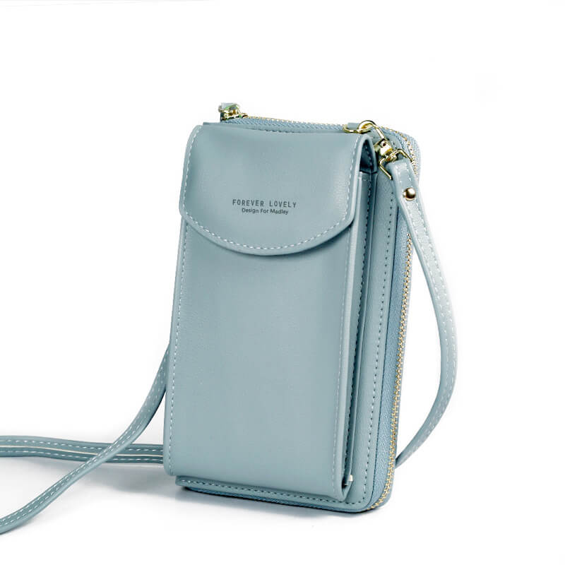 Kompakt reiseveske for damer i slitesterkt PU-lær, ideell som crossbody.
