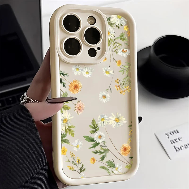 iPhone med stilfullt mobildeksel i blomsterdesign; støtsikkert og lettvekt, gir robust telefonbeskyttelse.
