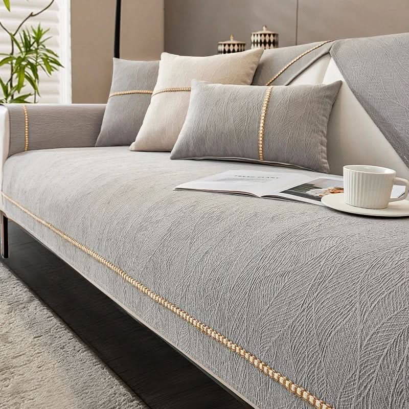 Stilig og funksjonelt sofatrekk for L-sofa. Sklisikkert design for trygg og pen stueinnredning.