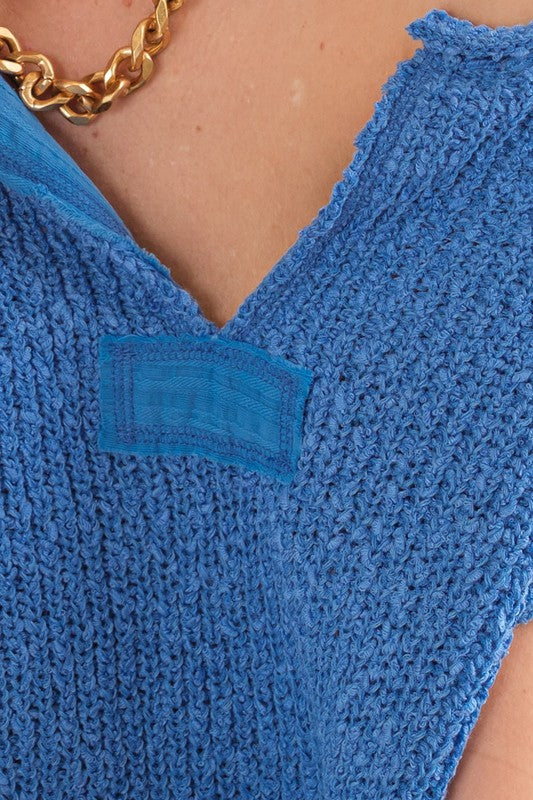 Motebevisst ermeløs genser til dame. Myk kvalitet med unik patch, flott for vår og sommer.