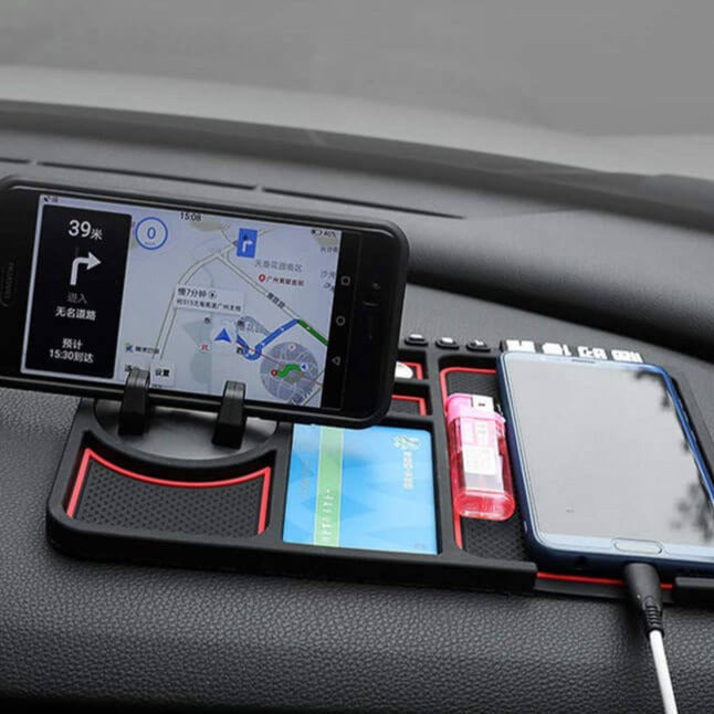 Svart silikon bilholder for telefon, med antiskli funksjon for sikker montering på dashbord.