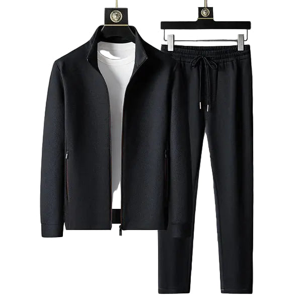 Svart dame treningsoverall med elegant snitt, perfekt for aktivitet og stil. Komfortabel kvinneoverall.