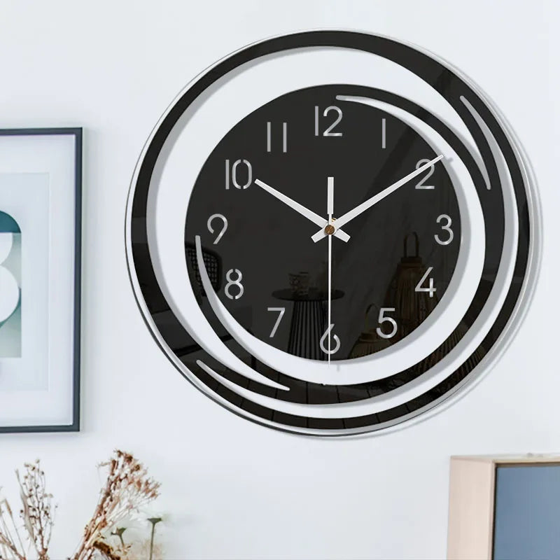 Geometrisk veggklokke i svart finish. Skandinavisk, lydløs og minimalistisk design. Passer til stue.