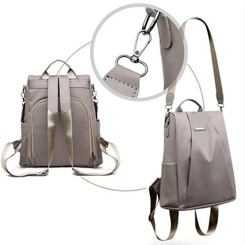 Allsidig kvinners ryggsekk, vanntett design i svart. Bruk som skulderveske, crossbody eller ryggsekk.
