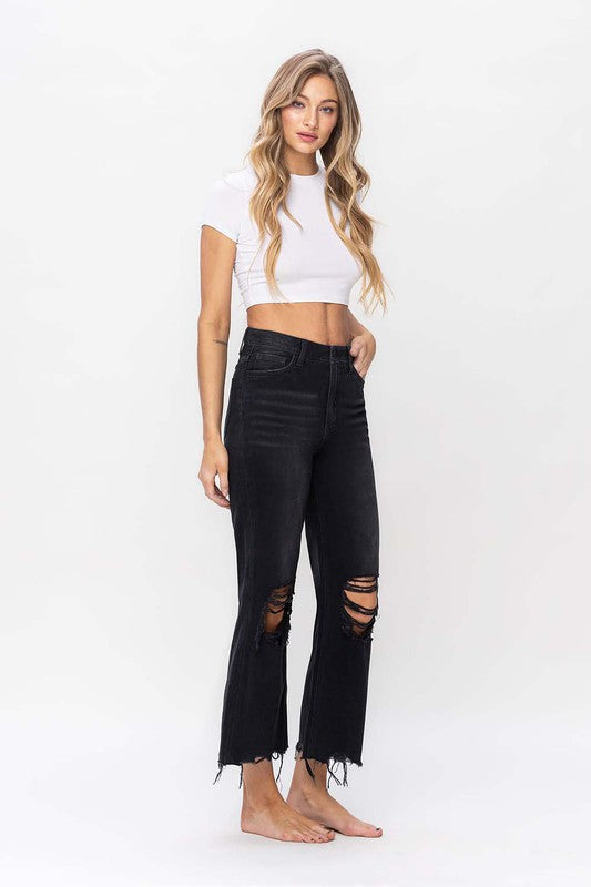 Komfortable allround svarte damejeans med crop flare. Høy midje i vintage 90-tallsstil for fest og hverdag.