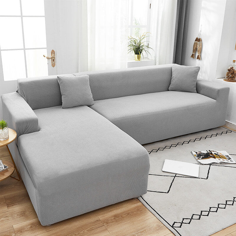 Optimal beskyttelse med et teksturert stretch sofatrekk; perfekt for aktive hjem.
