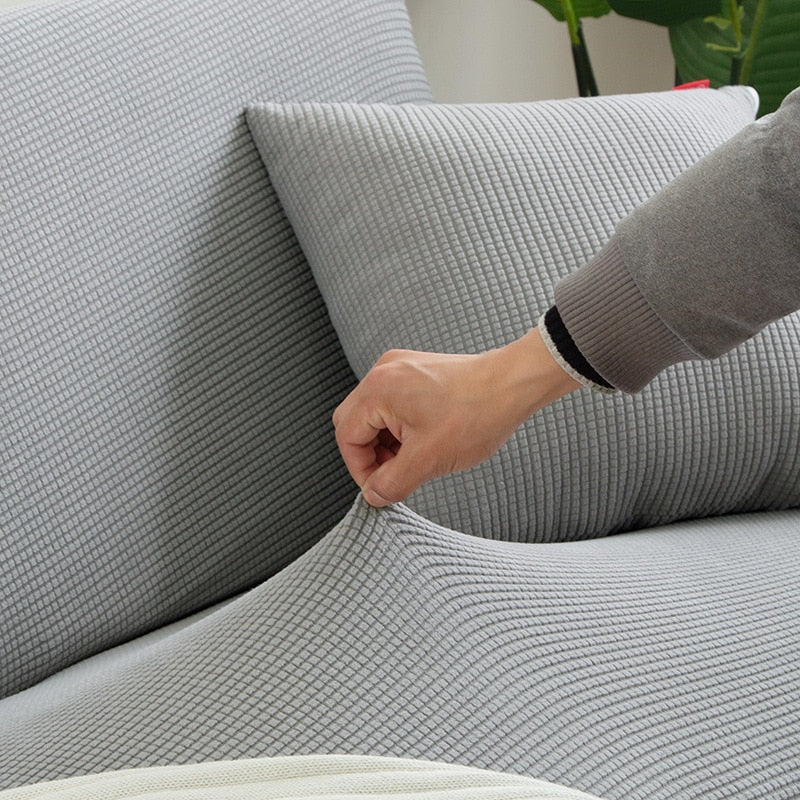 Moderne teksturert stretch sofatrekk i polyester for et elegant og vedlikeholdsvennlig hjem.