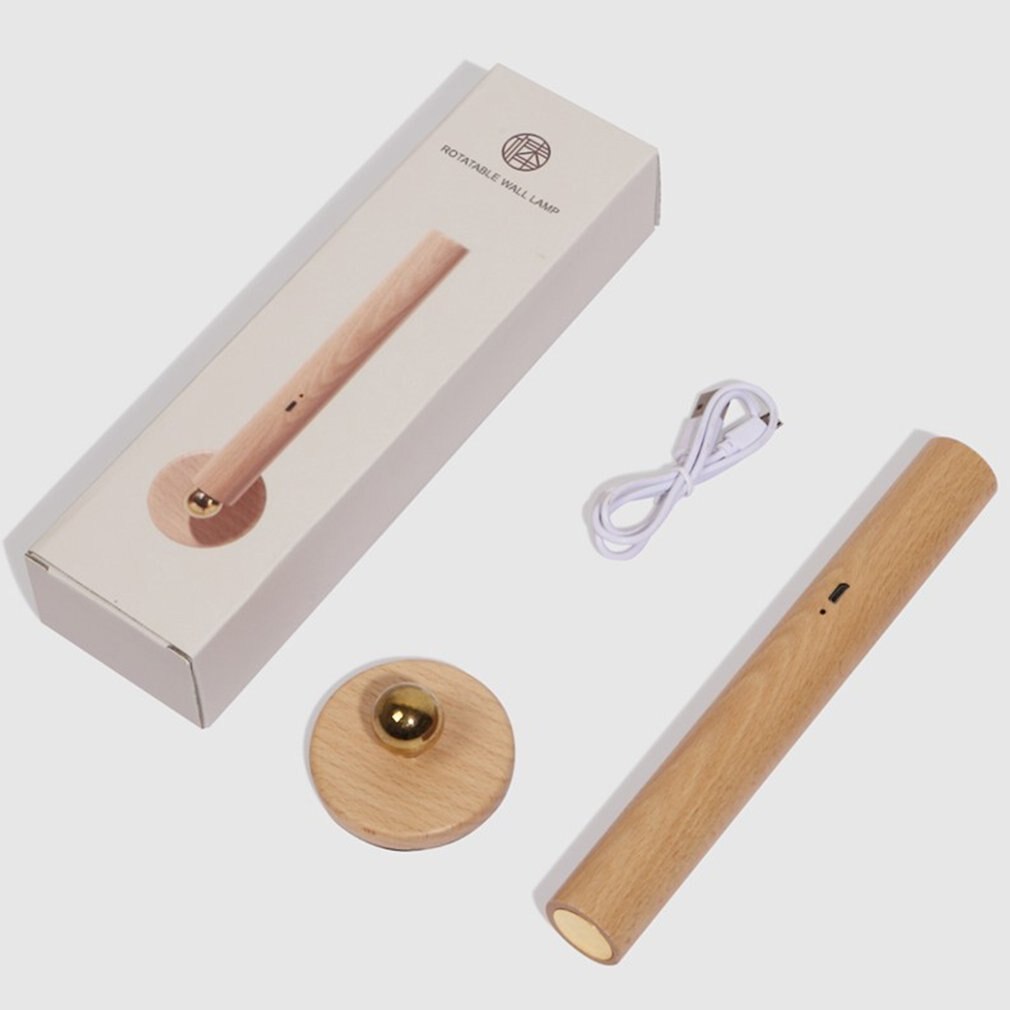 Trådløs LED-lampe i lyst tre med magnetisk feste. Gir dimbar 360° rotasjon for perfekt belysning og dekor.