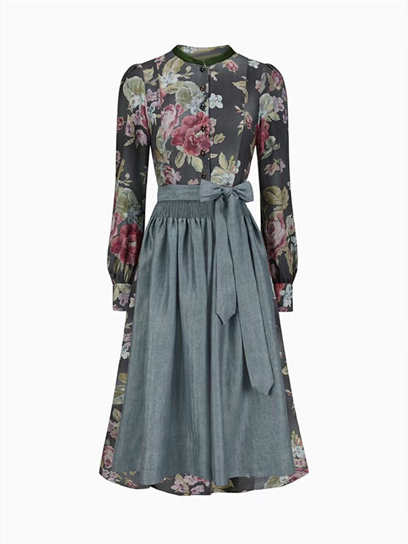 Nærbilde av dirndl kjolens bodice, blonder og levende blomstermønster, en elegant tradisjonell festkjole.