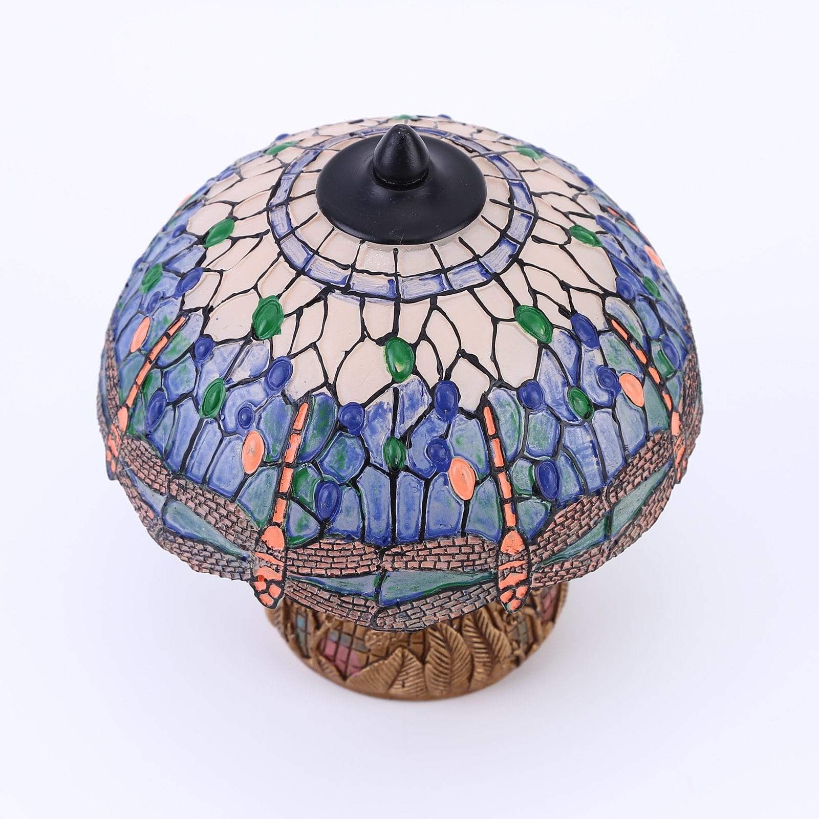 Nærbilde av detaljert øyenstikkerdesign på unik vintage lampe. Gir varmt og innbydende stemningslys.