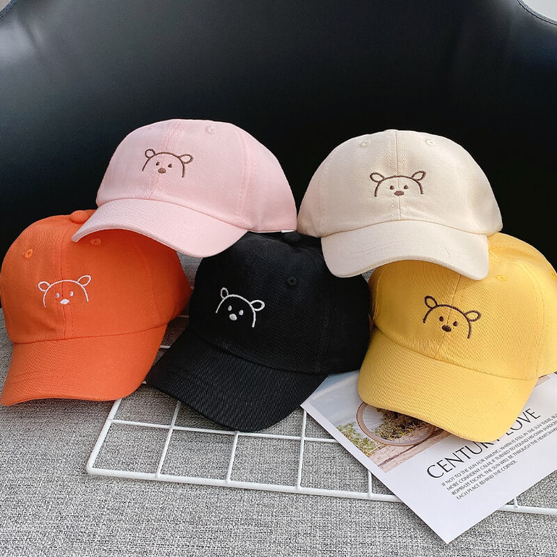 UV-beskyttende unisex barnelue, tegneseriebjørn for sommer og lek.