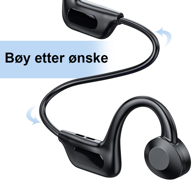 Nærbilde av ladeport på trådløse benledning hodetelefoner, moderne elektronikk.
