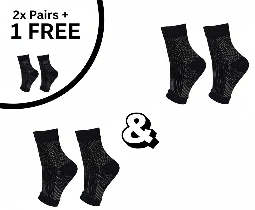 Et par unisex kompresjonssokker på hvit bakgrunn, designet for blodsirkulasjon, sport og daglig komfort.