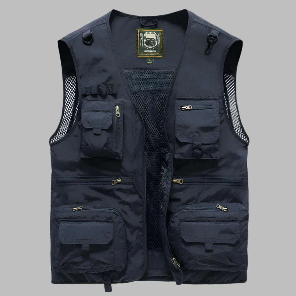 Stilig og funksjonell utility-vest for unisex. Ideell som sommer- og vårklær, med mange lommer og pustende stoff.