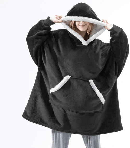Koselig, overdimensjonert hettegenserteppe i mykt stoff, perfekt for avslapning i sofaen.