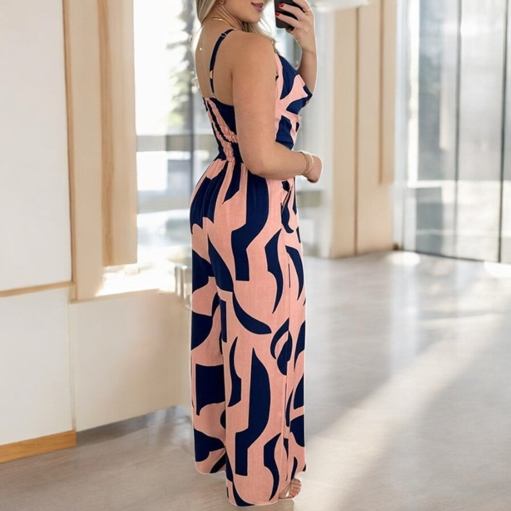 Kvinners elegant jumpsuit med dyp V-hals og sensuell åpen rygg. Brede ben gir en flytende look.